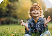 cute-boy-sit-grass-park